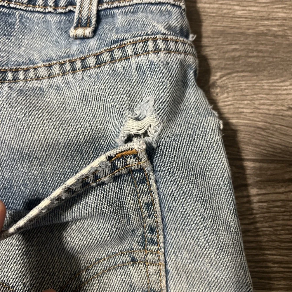Vintage Levi's 550 Heavily Distressed Light Wash Blue Jean Shorts Size 32x10 USA